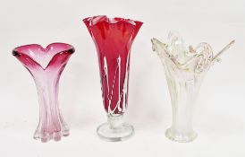 An art glass ruby-tinted flared vase with frilled rim, marbled and trailed in white, 37cm high; a