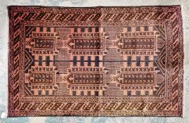 Hand knotted Pakistan rug, 100% wool, black symbols on rust coloured centre piece with brown and