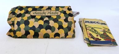 Collection of loose Meccano parts including wheels and cogs plus three instruction booklets for