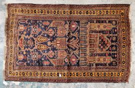 Pakistan hand knotted rug, 100% wool, blue background with coral and mustard, garden symbols in