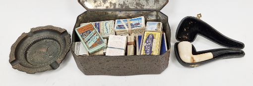 Mixed lot including a cased clay pipe, 1940's Greek cast metal ashtray and a tin of cigarette