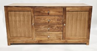 Modern pale hardwood sideboard comprising a central bank of four drawers flanked either side by