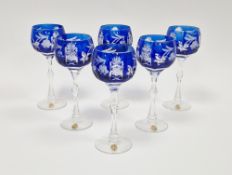 Six contemporary German blue-flashed, cut and etched wine-glasses, each cut with fruiting vine and
