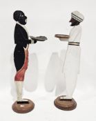 Two early to mid century wooden painted floor standing dumb waiters in the form of servants