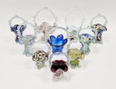 10 spatter glass baskets in sizes, including cased and combed examples, each with frilled rim and