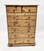 Modern pine chest of two short over five long drawers, raised on squat bun feet, 81cm wide x 41cm