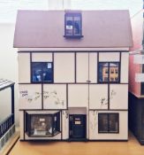 Scratch-built wooden dolls house with two panels opening to front and hinged lift-up roof