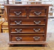 Hardwood table-top cabinet in the form of a George III chest of two short and three long drawers,