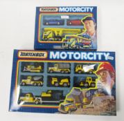 Two boxed Matchbox 'Motorcity' diecast vehicle gift sets including MC8 (MC-8) 7 vehicle road