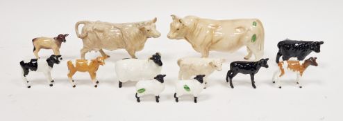 Beswick bull, a Beswick cow and a selection of smaller Beswick farm animals to include sheep, ram