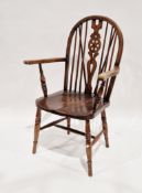 Elm and beech Windsor elbow chair, the hoop and stick back with wheel carved splat, 63cm wide x 15cm
