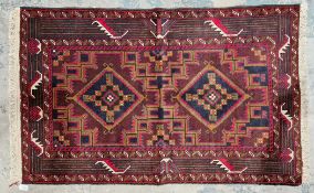 Hand made in Pakistan rug, diamond style centre patterns in blue, red and green with ususual