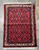 Hand knotted Iranian rug of finest quality, with red, blue and green designs inlay, 63cm x 88cm