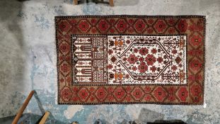 Afghan rug, floral design, cream background, the centre brown with red and brown floral borders,