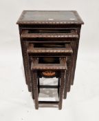 Set of four Chinese/South East Asian hardwood tables, each carved with geometric motifs and