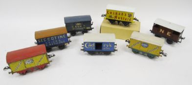 Six Hornby '0' gauge goods wagons to include Cadburys, Carrs Biscuits, Fyffes Bananas, Ceccotine and