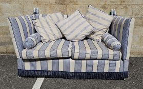 Knole style two-seater sofa with double drop arms, upholstered in a blue and cream striped fabric,