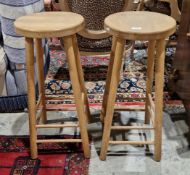 Pair of modern beech wood high stools with circular seats and raised on turned supports, each 31cm