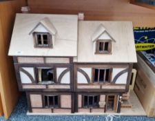 Scratch-built dolls house in the form of a Tudor house with watermill on the side containing various