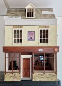 Scratch-built doll's house in the form of a tavern or public house, the single hinged front