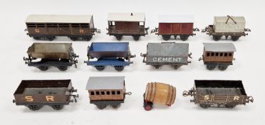Collection of eleven tinplate 0 gauge items of rolling stock including Hornby flat truck with S R
