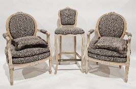 Pair of French-style Fauteuil elbow chairs with limed wooden frames and leopardskin patterned
