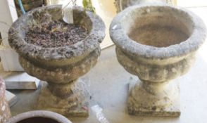 Pair of stone urns on square supports (one damaged), 40cm high (2)