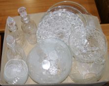 Assorted glassware to include fruit bowls, decanters, platters, pudding dishes, a mantel clock