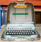 Cased Imperial 'good companion 4' typewriter with original instructions