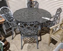 Modern metal garden suite comprising a circular dining table, 122cm diameter and four matching