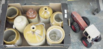 Two stoneware flagons, two stoneware bottles and four stoneware jars together with toy Ertl