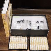 Two boxes of clear and brown chemist's bottles and two boxes of  Keene & Ashwell homoeopathic