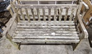 Teak two-seater garden bench, 83cm high x 122cm wide x 57cm deep
