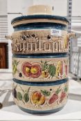 West German rumtoft jar in creams and greens decorated with fruits and vegetables