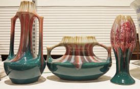 Three mid century 1920's/30's striped glazed vases, one tulip-shaped, 26cm high, one twin-handled,