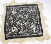 A Chinese embroidered piano shawl, cream embroidery depicting pagodas, bridges, flowers etc. on a