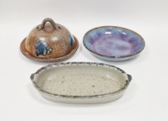 Ned Heywood MBE (b.1947) a studio pottery shallow bowl, mottled purple glaze on blue ground,