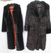 A vintage black faux astrakhan coat with black mink collar and deep cuffs, double breasted and