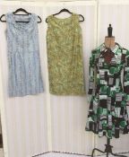 Various early 1970's and other vintage dresses to include a green and black abstract design shirt