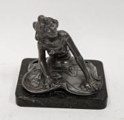 Art Nouveau electroplated WMF figure of a seated dancing girl, stamped to reverse WMFEP, raised on a
