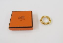 Hermes gilt coloured metal scarf ring,  Ludgate Shane Dunkle design formed as looped 'H's', in