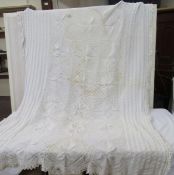 A large cream knitted bed cover - some stains to the edges (double bed size)