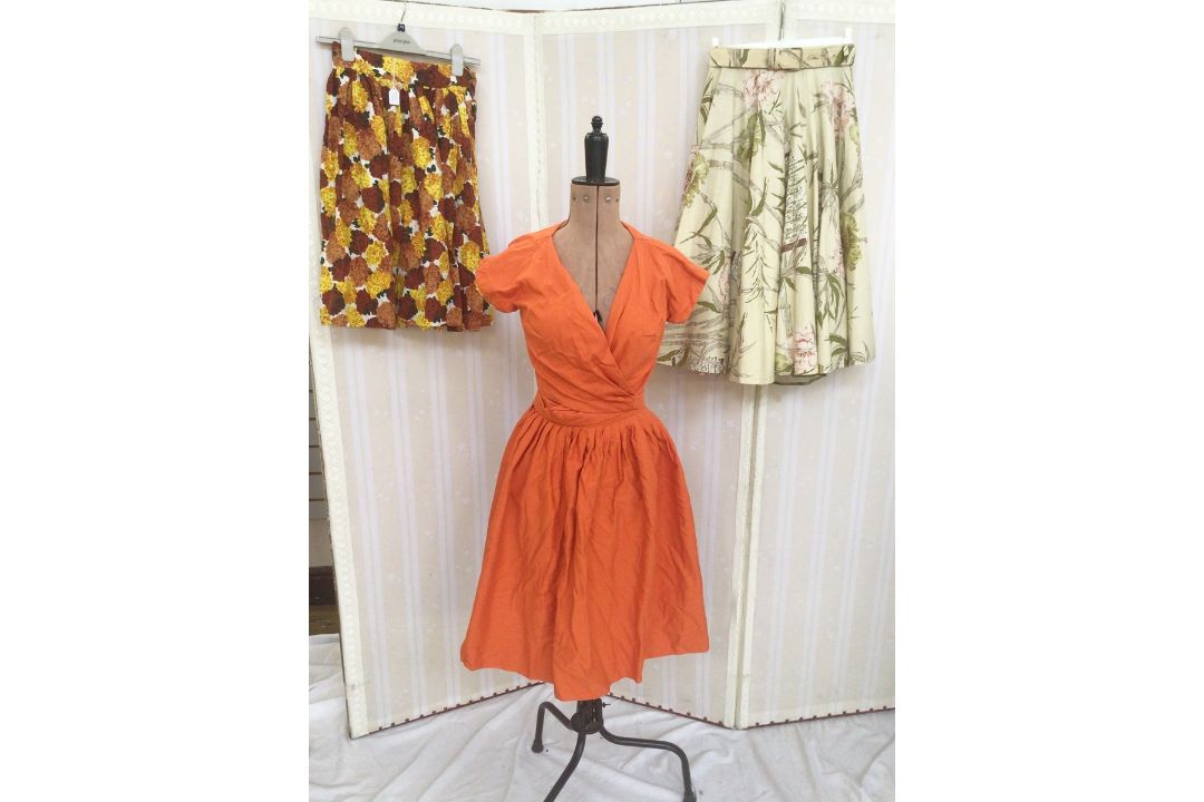 1950's/'60's full skirts, various patterns, a plain orange skirt with matching top with tie waist, - Image 1 of 3