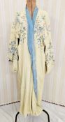 A 1920's reversible silk kimono, pale blue one side and pale cream the other, printed with