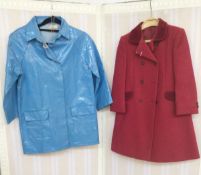 A red wool child's coat, velvet collar and pocket detail, double breasted, labelled St Michael