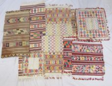 Various Moroccan/Afghan hand-loom embroidered pieces of fabric, to include mats, remnants, table