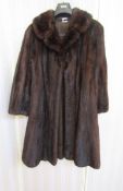 Dark ranch mink full length coat, satin embroidered lining with inset tie waist belt