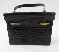 Dunhill black crocodile handbag, with gilt side clip fastening, flap front, gilt coloured metal