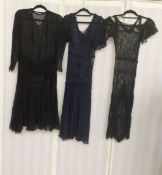 Two 1920's lace dresses, lacking underskirts and with some damage, a 1920's black chiffon dress (