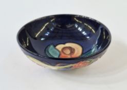 Moorcroft pottery shallow bowl decorated in the 'Queens Choice' pattern, 12cm diameter
